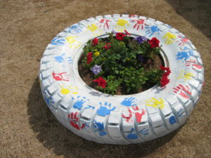 tire with a garden planted in the middle